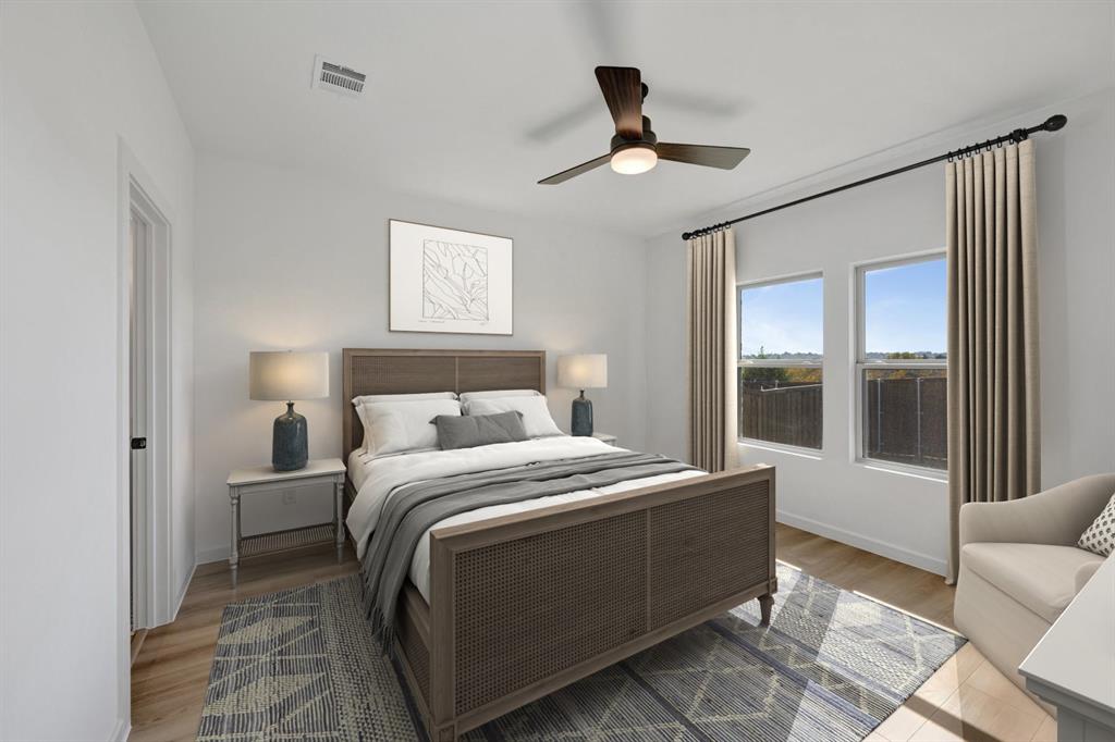 1424 Elliott Road Howe, TX 75459 - Photo 12 of 28 a bedroom with a bed and glass door