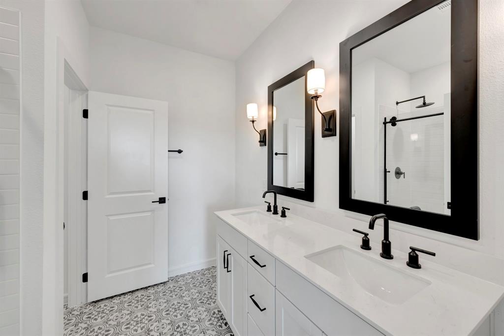 1424 Elliott Road Howe, TX 75459 - Photo 15 of 28 a bathroom with double vanity sink and two mirror