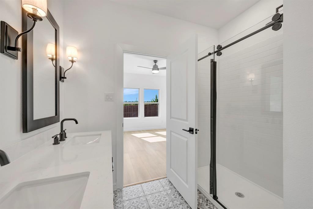 1424 Elliott Road Howe, TX 75459 - Photo 16 of 28 a bathroom with a shower and a sink