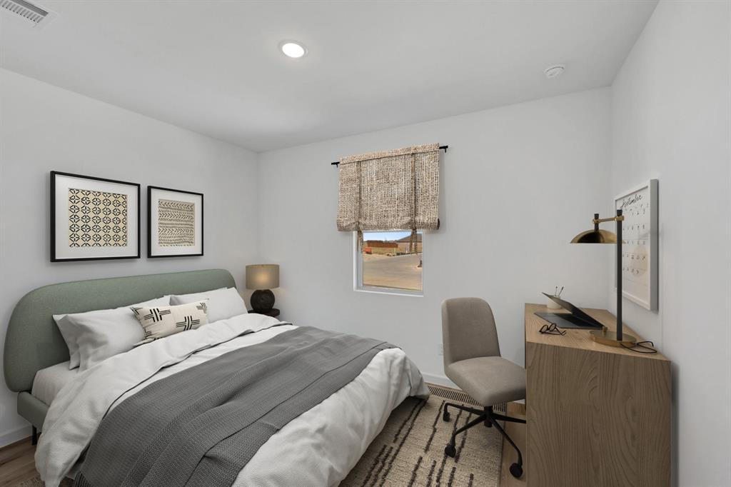 1424 Elliott Road Howe, TX 75459 - Photo 21 of 28 a bedroom with a bed and a chair