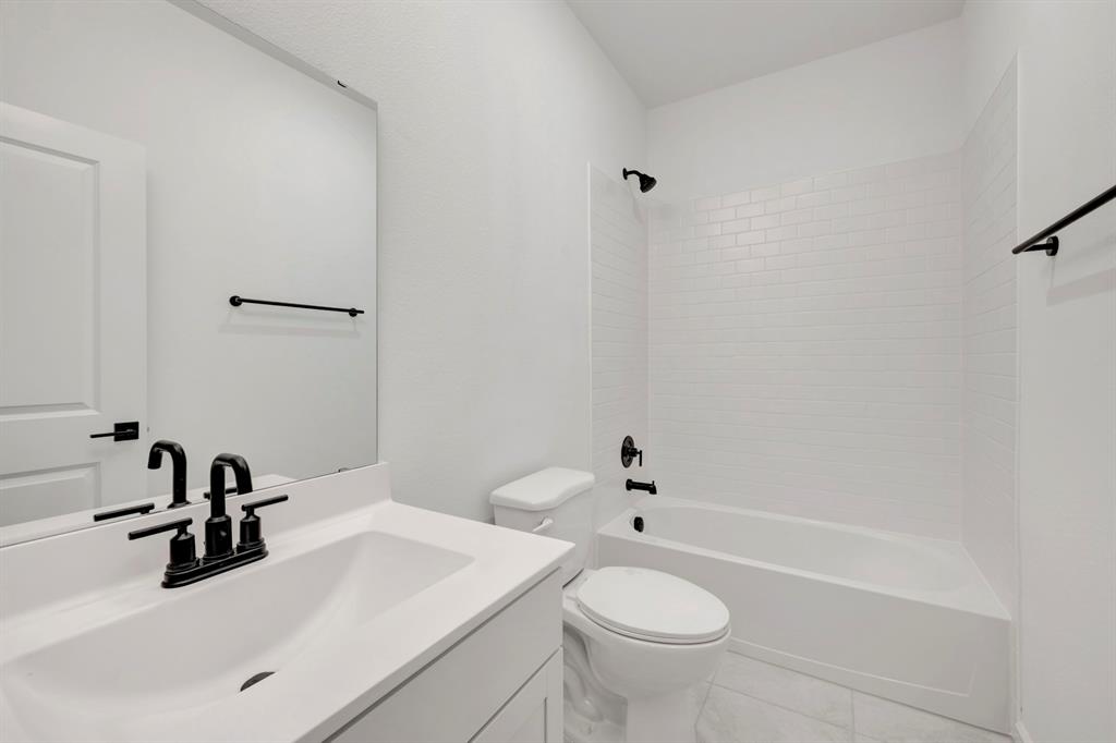 1424 Elliott Road Howe, TX 75459 - Photo 22 of 28 a bathroom with a sink and a mirror