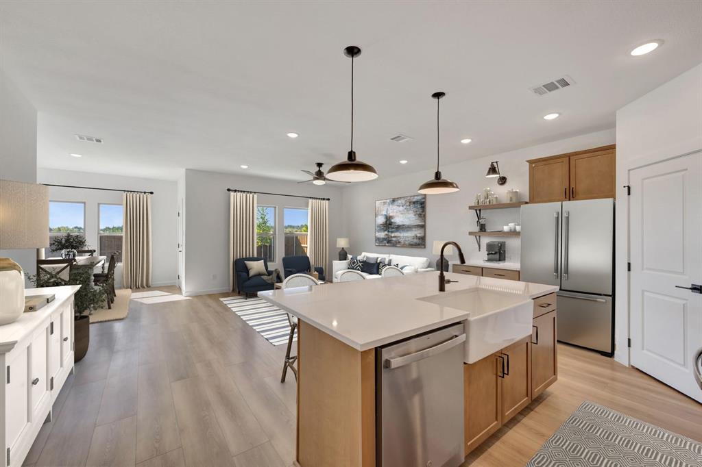 1424 Elliott Road Howe, TX 75459 - Photo 8 of 28 a kitchen with stainless steel appliances granite countertop a sink a stove and a refrigerator