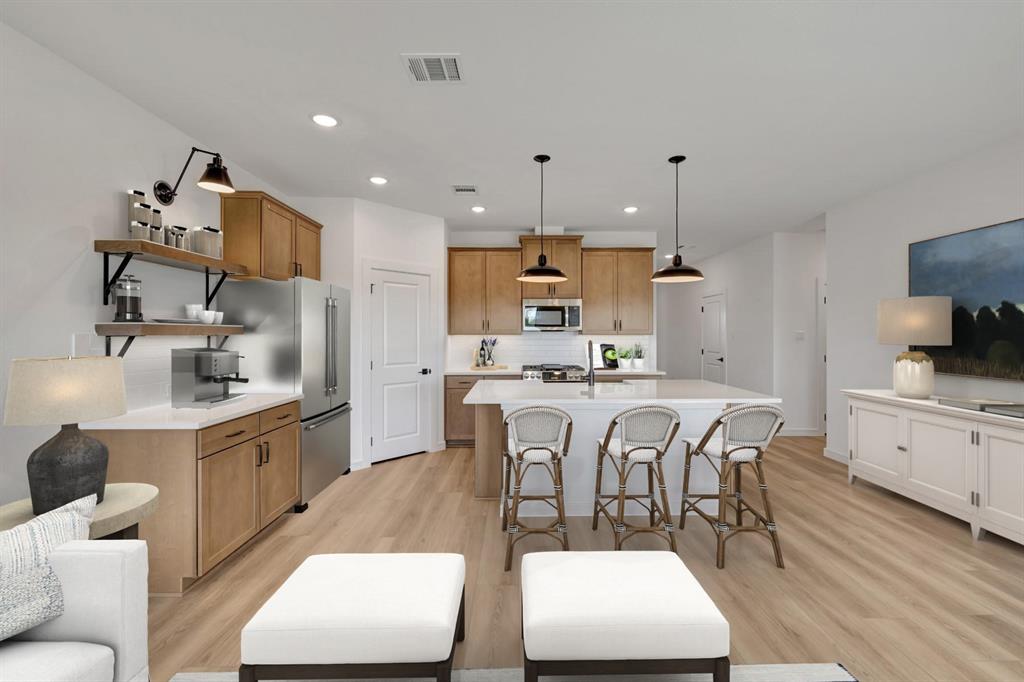 1424 Elliott Road Howe, TX 75459 - Photo 10 of 28 a large kitchen with stainless steel appliances kitchen island granite countertop a sink and cabinets