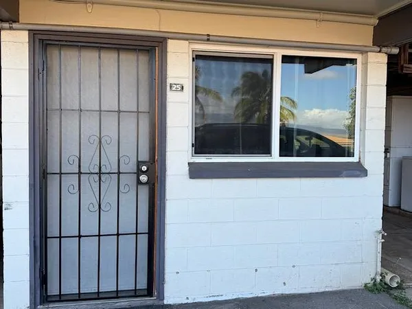 a view of a door and a window