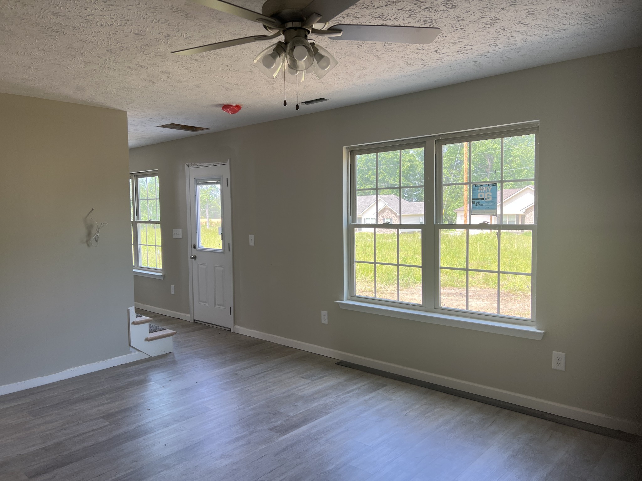 106 Timber Circle Manchester, TN 37355 - Photo 12 of 13 a view of an empty room with a window and wooden floor