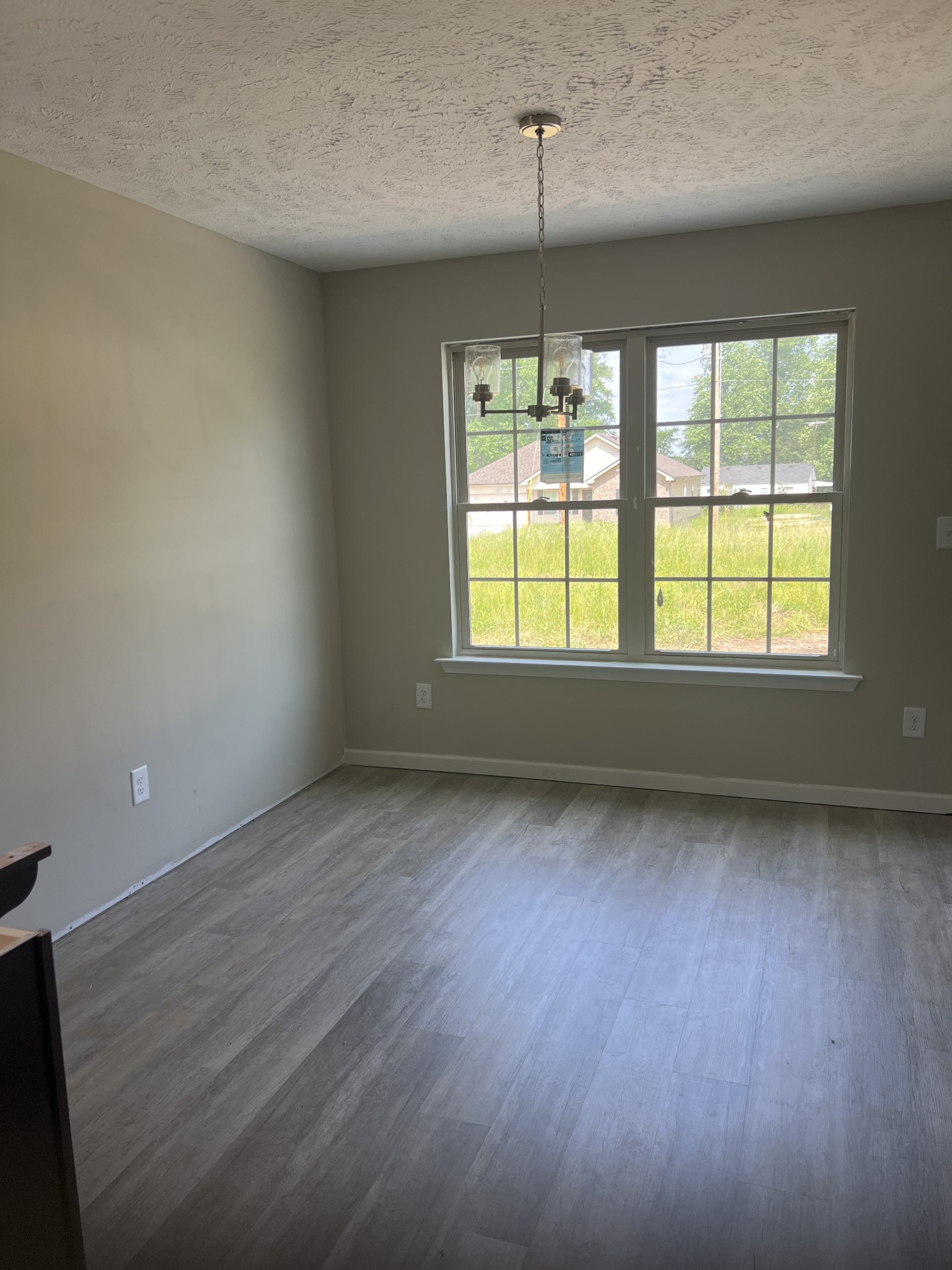 106 Timber Circle Manchester, TN 37355 - Photo 6 of 13 an empty room with wooden floor and windows
