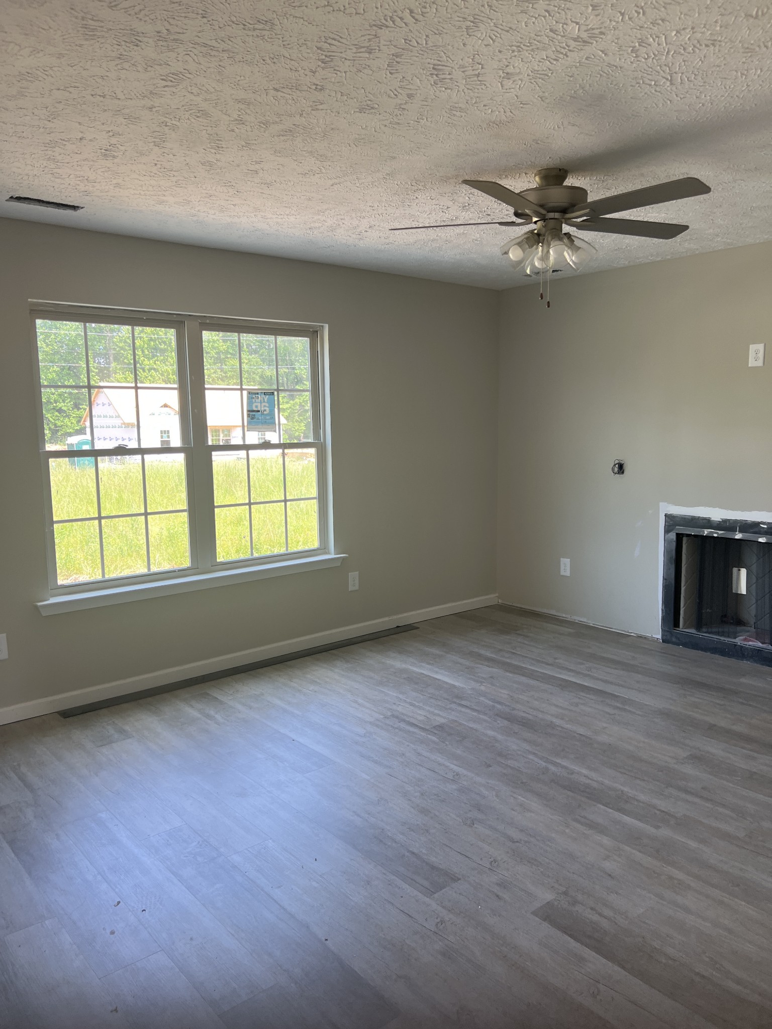 106 Timber Circle Manchester, TN 37355 - Photo 8 of 13 wooden floor in an empty room with a window