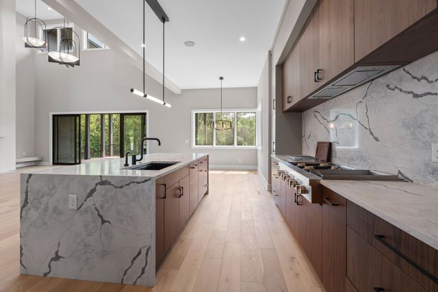 a kitchen with a sink and a stove