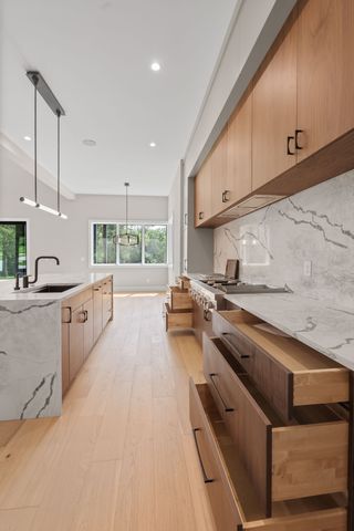 a view of a room with an empty space and wooden floor