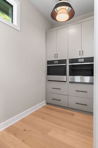 a view of an empty room with a fireplace