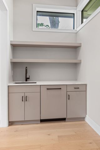 a view of an empty room with a fireplace and a window