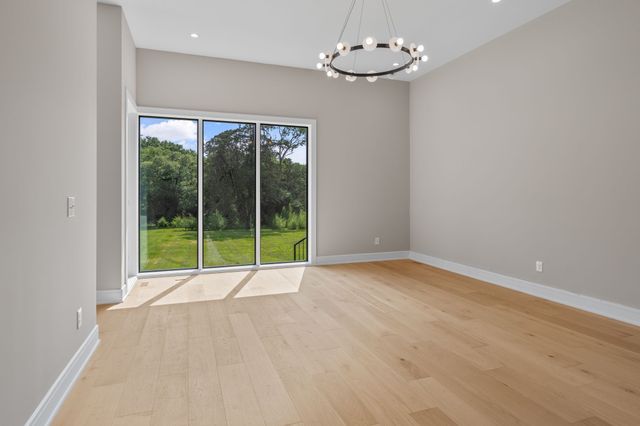 a bathroom with a double vanity sink mirror and bathtub