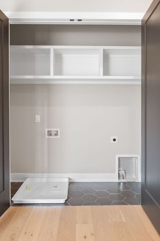 a view of a big room with wooden cabinet and windows