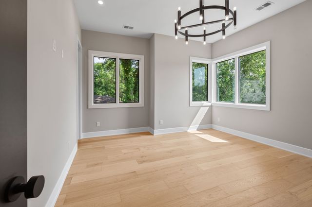 a bathroom with a tub a sink and a toilet