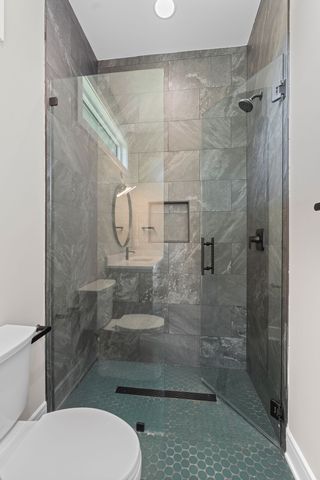 a view of a house with yard and a tree