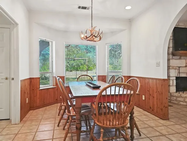 a view of a dining room with furniture window and outside view
