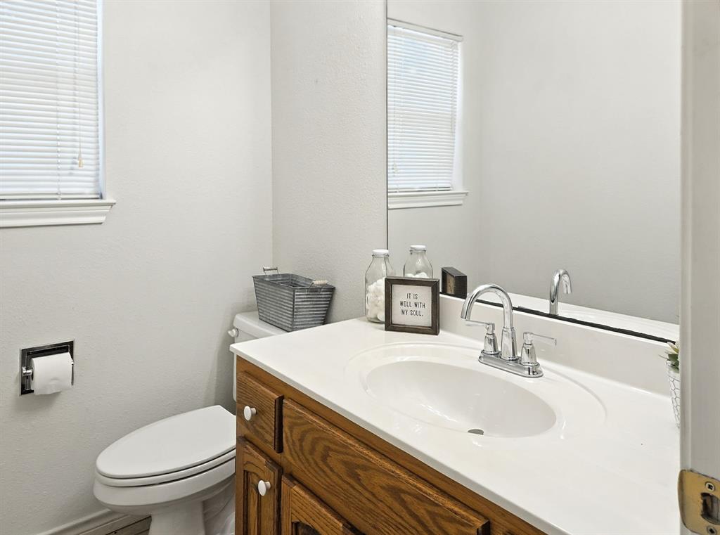 895 Pr 202 / Highway Hamilton, TX 76531 - Photo 22 of 40 a bathroom with a sink a toilet and mirror