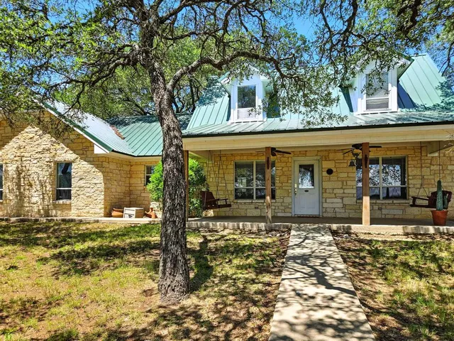 front view of a house with a trees