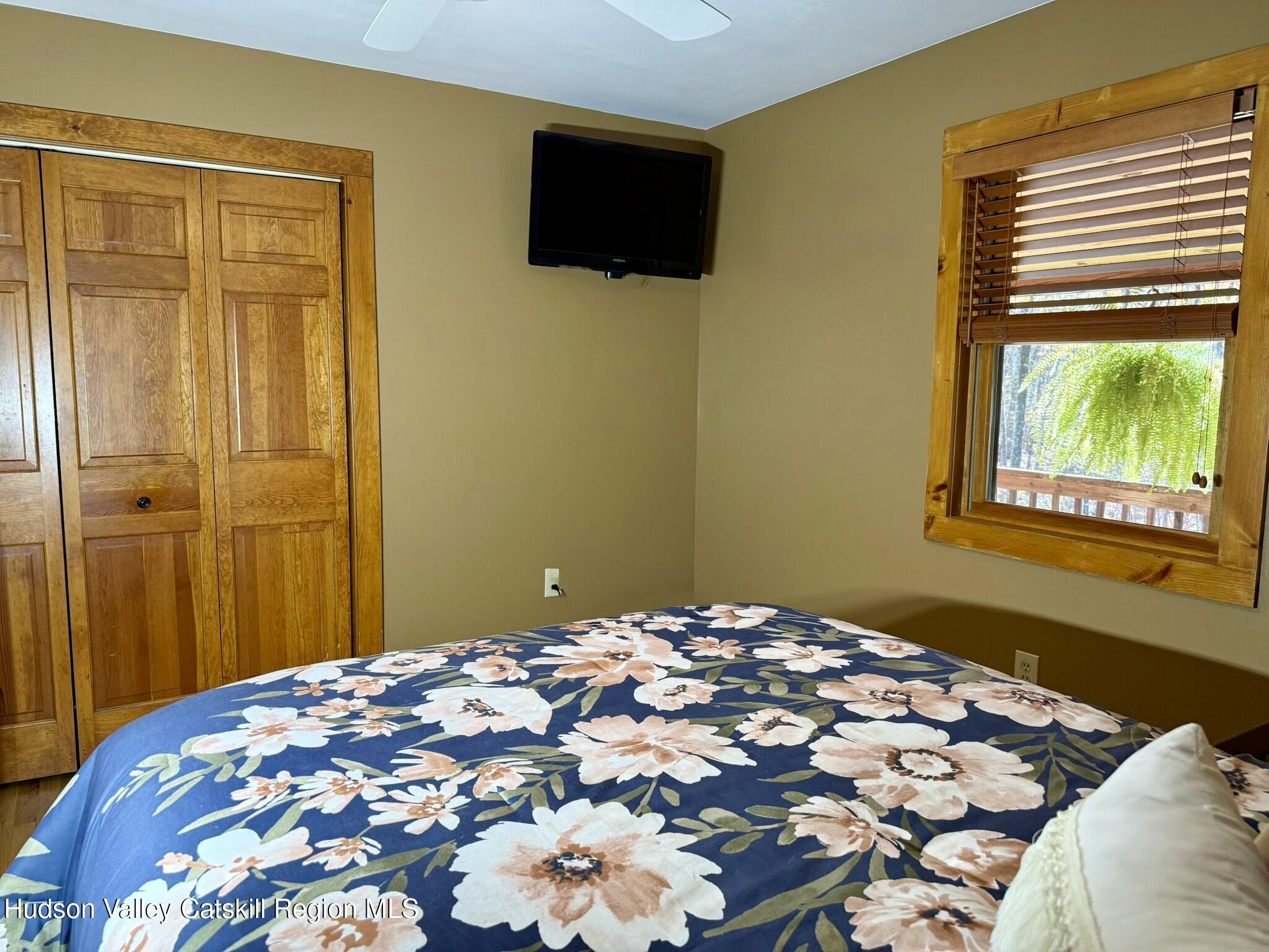 485 Potic Mountain Road Catskill, NY 12414 - Photo 12 of 46 a bedroom with a bed and a window