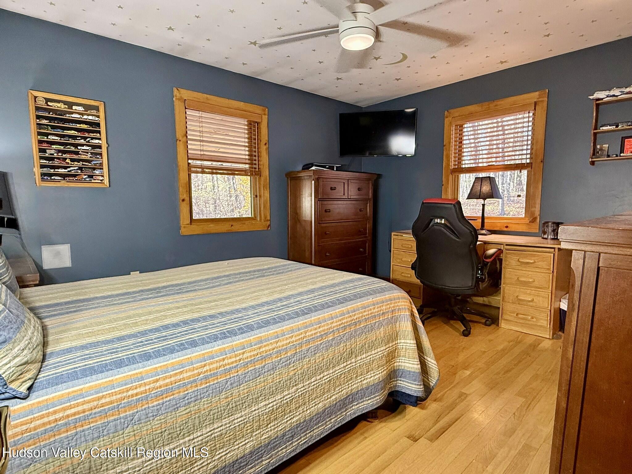 485 Potic Mountain Road Catskill, NY 12414 - Photo 16 of 46 a bedroom with bed and wooden floor