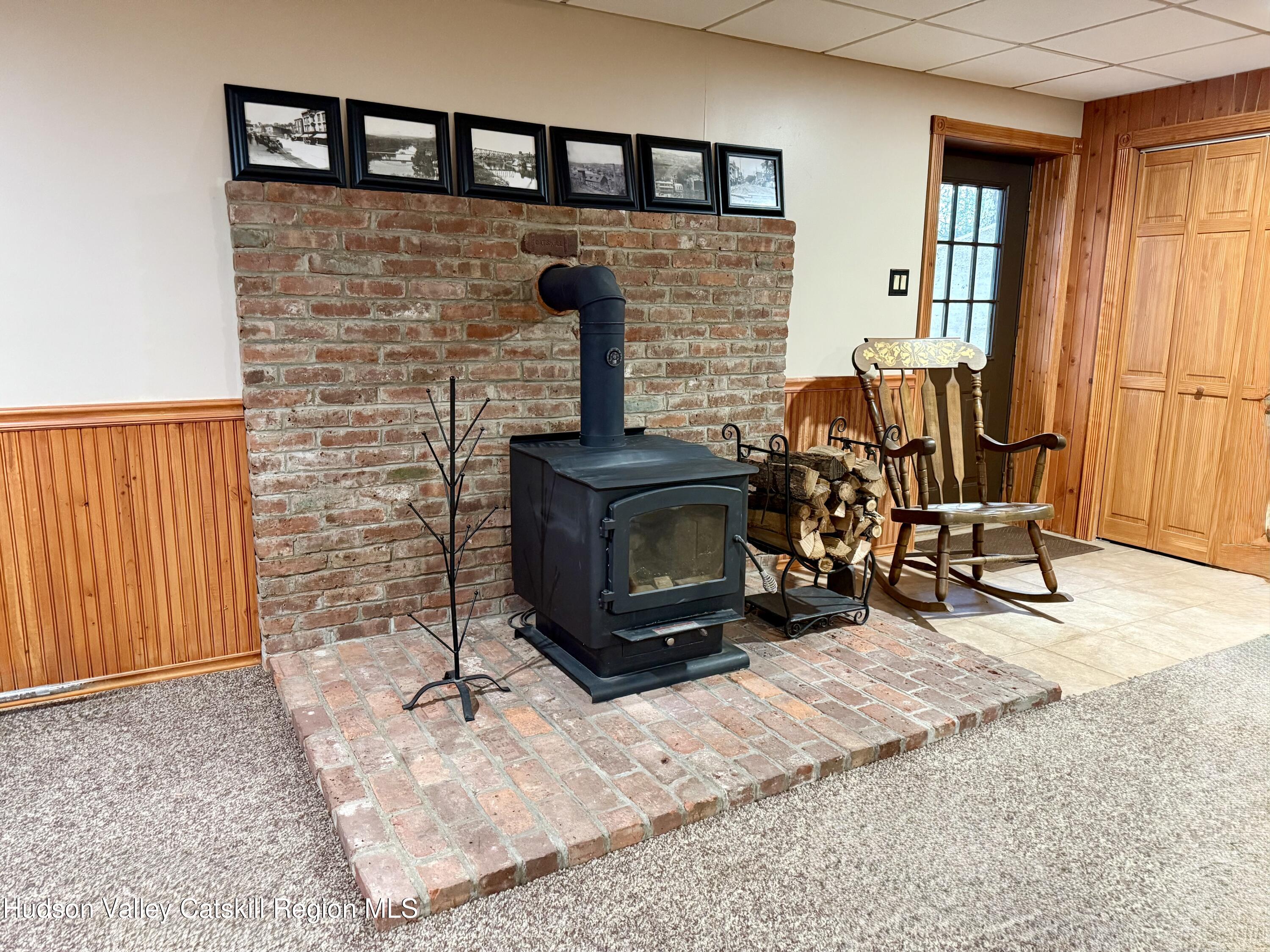 485 Potic Mountain Road Catskill, NY 12414 - Photo 21 of 46 a living room with fireplace furniture and a window