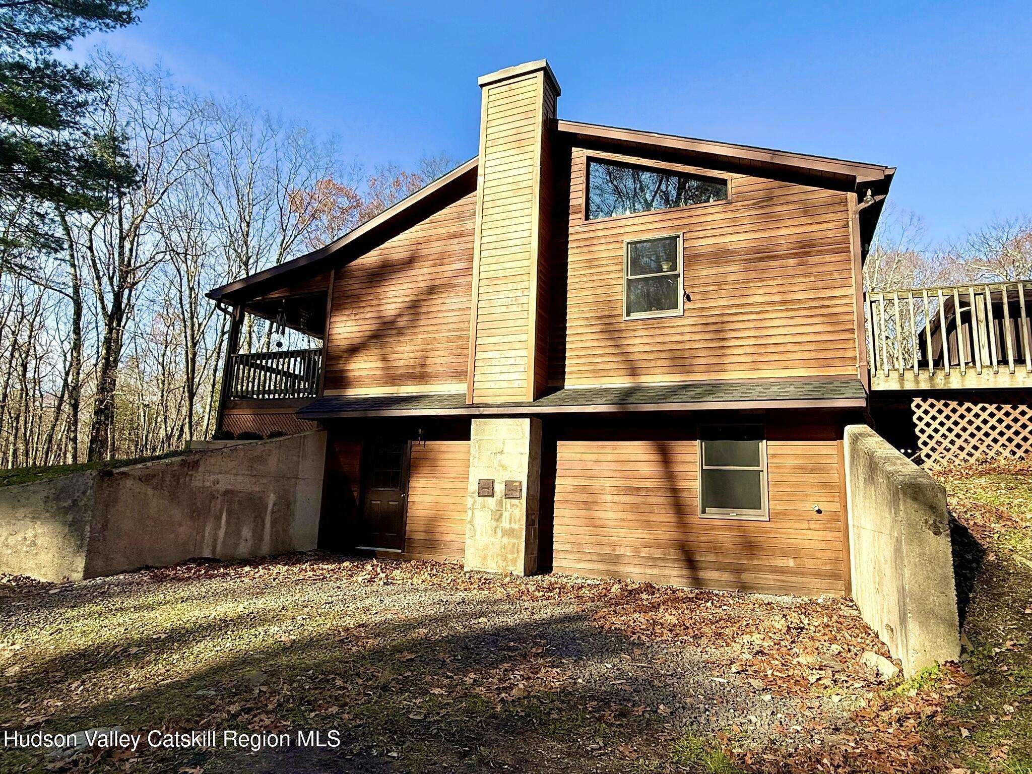485 Potic Mountain Road Catskill, NY 12414 - Photo 3 of 46 a front view of a house with a yard