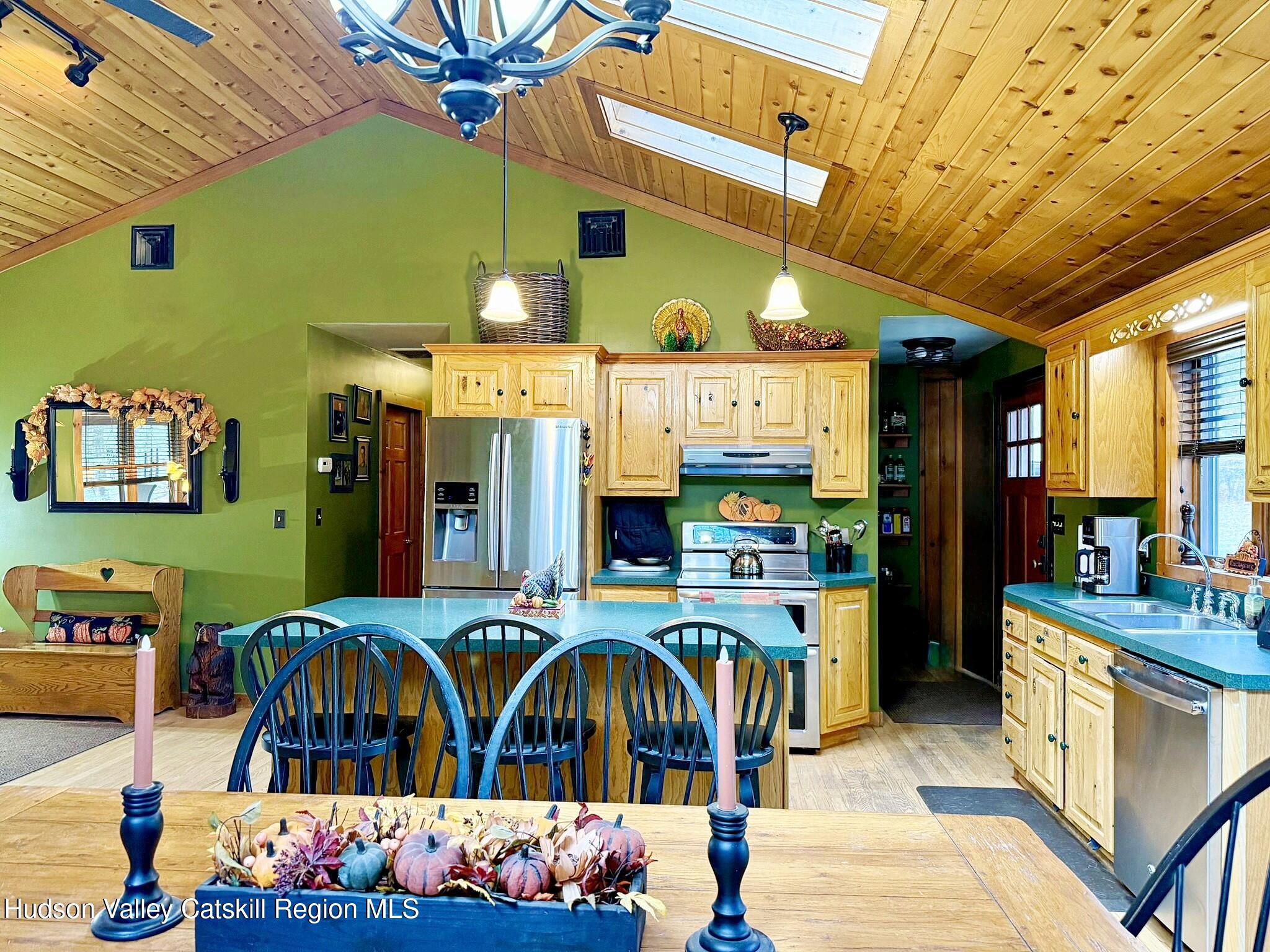 485 Potic Mountain Road Catskill, NY 12414 - Photo 44 of 46 a view of a dining area with chairs