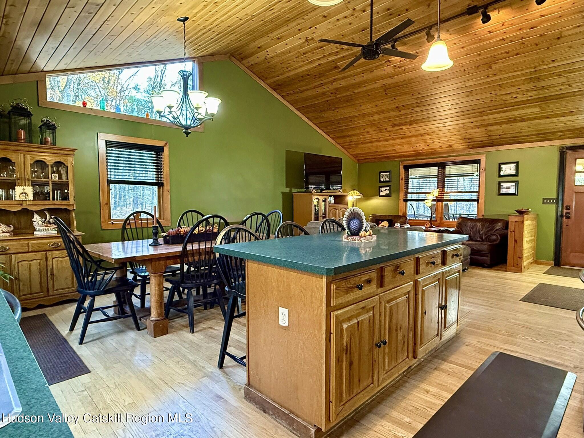 485 Potic Mountain Road Catskill, NY 12414 - Photo 45 of 46 a kitchen with stainless steel appliances granite countertop a dining table and chairs