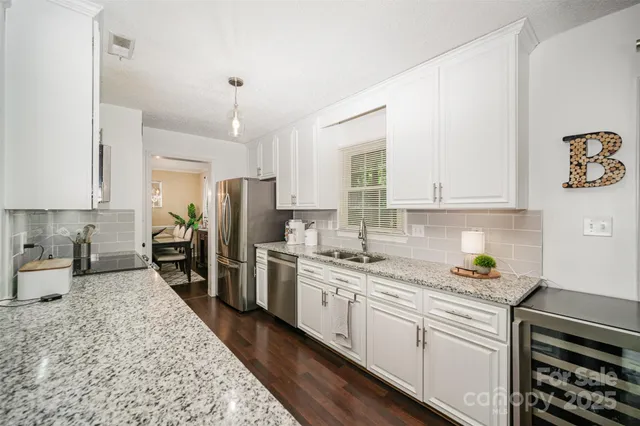a kitchen with a sink stove and refrigerator
