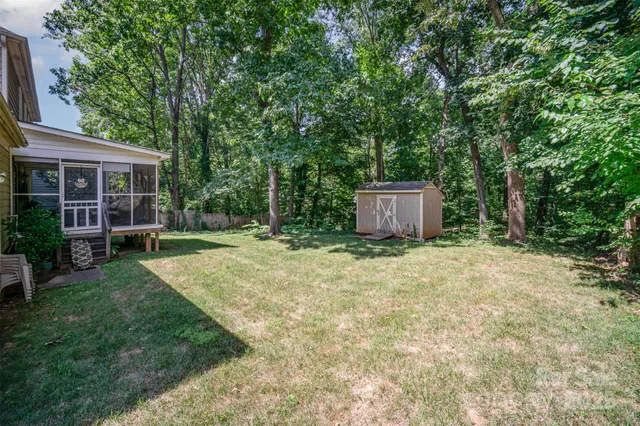 a backyard of a house with lots of green space