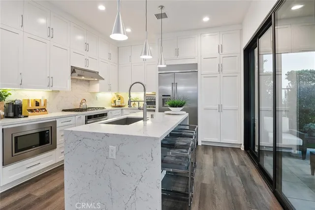 a bathroom with a bathtub sink and mirror