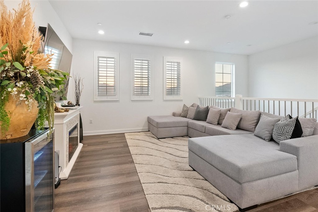 20732 Beech Circle Porter Ranch, CA 91326 - Photo 19 of 72 a living room with furniture and a flat screen tv