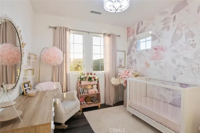 a view of an outdoor dining space with a table and chairs