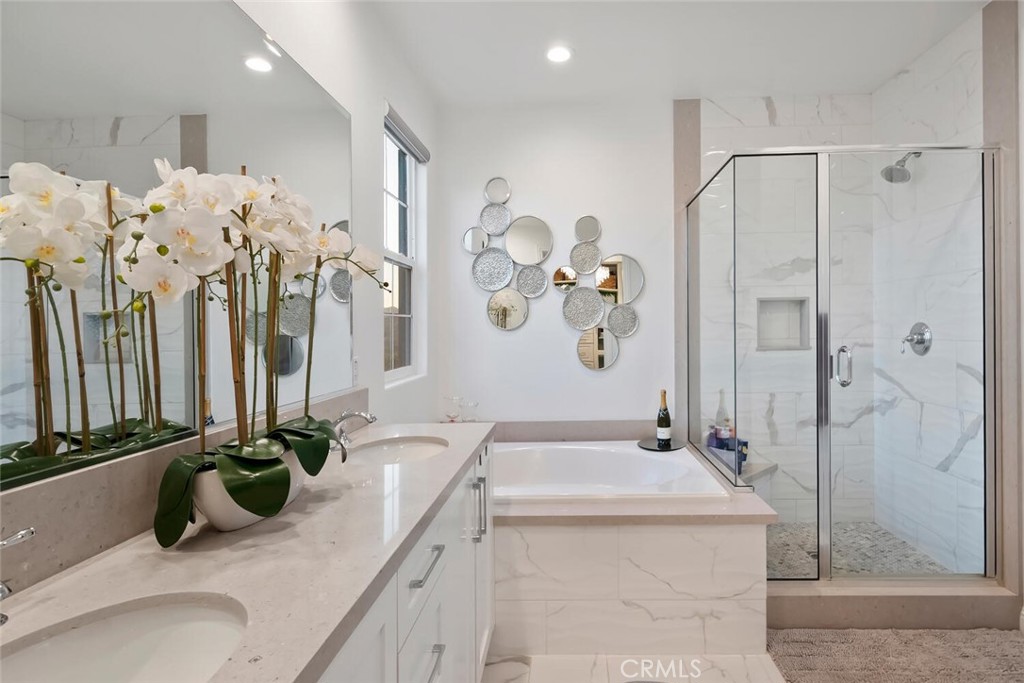 20732 Beech Circle Porter Ranch, CA 91326 - Photo 32 of 72 a bathroom with a tub sink and mirror
