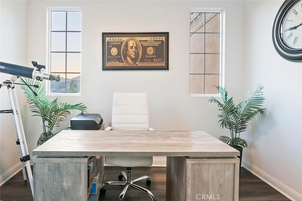 20732 Beech Circle Porter Ranch, CA 91326 - Photo 35 of 72 a room with table and potted plant