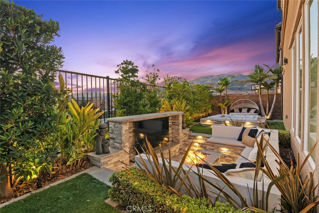 20732 Beech Circle Porter Ranch, CA 91326 - Photo 48 of 72 a view of a patio with table and chairs and potted plants with wooden floor and city view