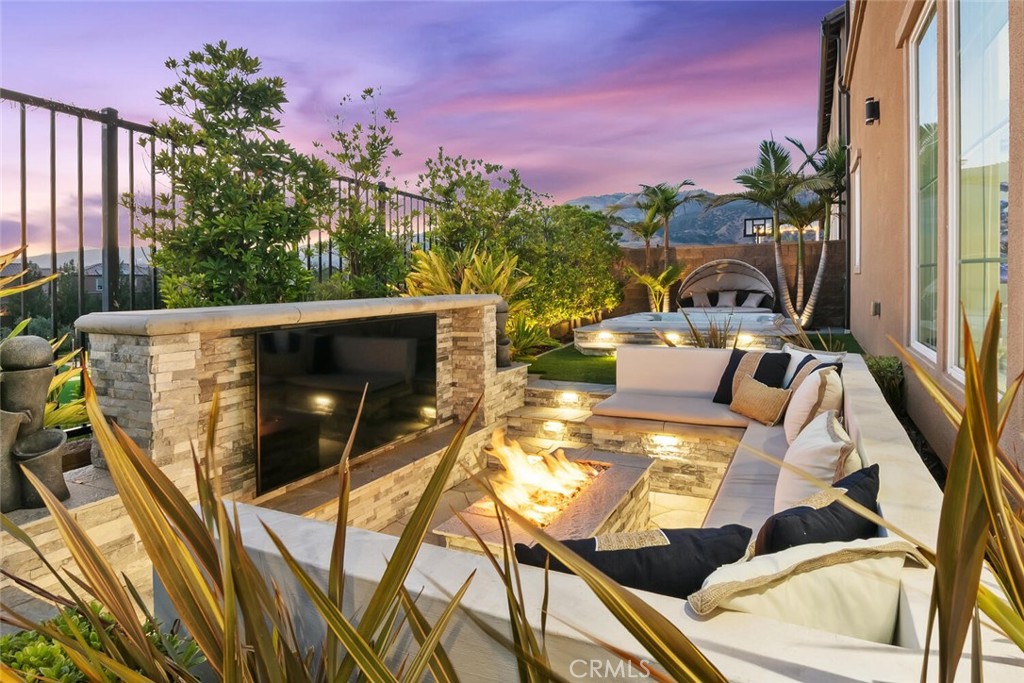 20732 Beech Circle Porter Ranch, CA 91326 - Photo 54 of 72 a view of an outdoor dining space with a table and chairs