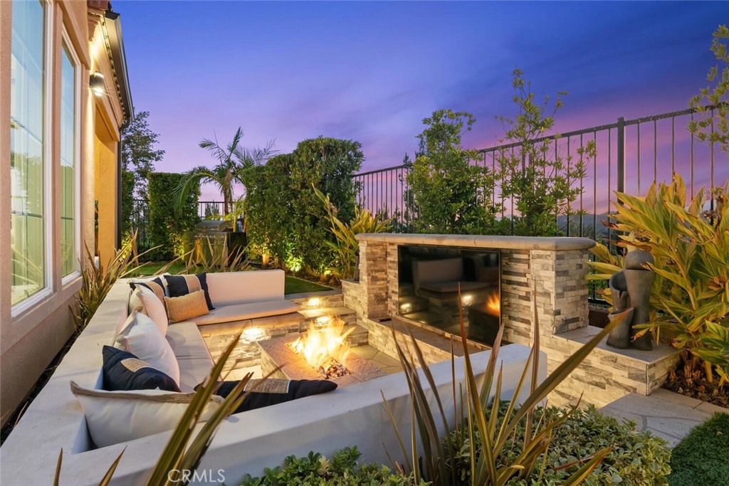 20732 Beech Circle Porter Ranch, CA 91326 - Photo 56 of 72 a view of a backyard with couches potted plants and wooden fence