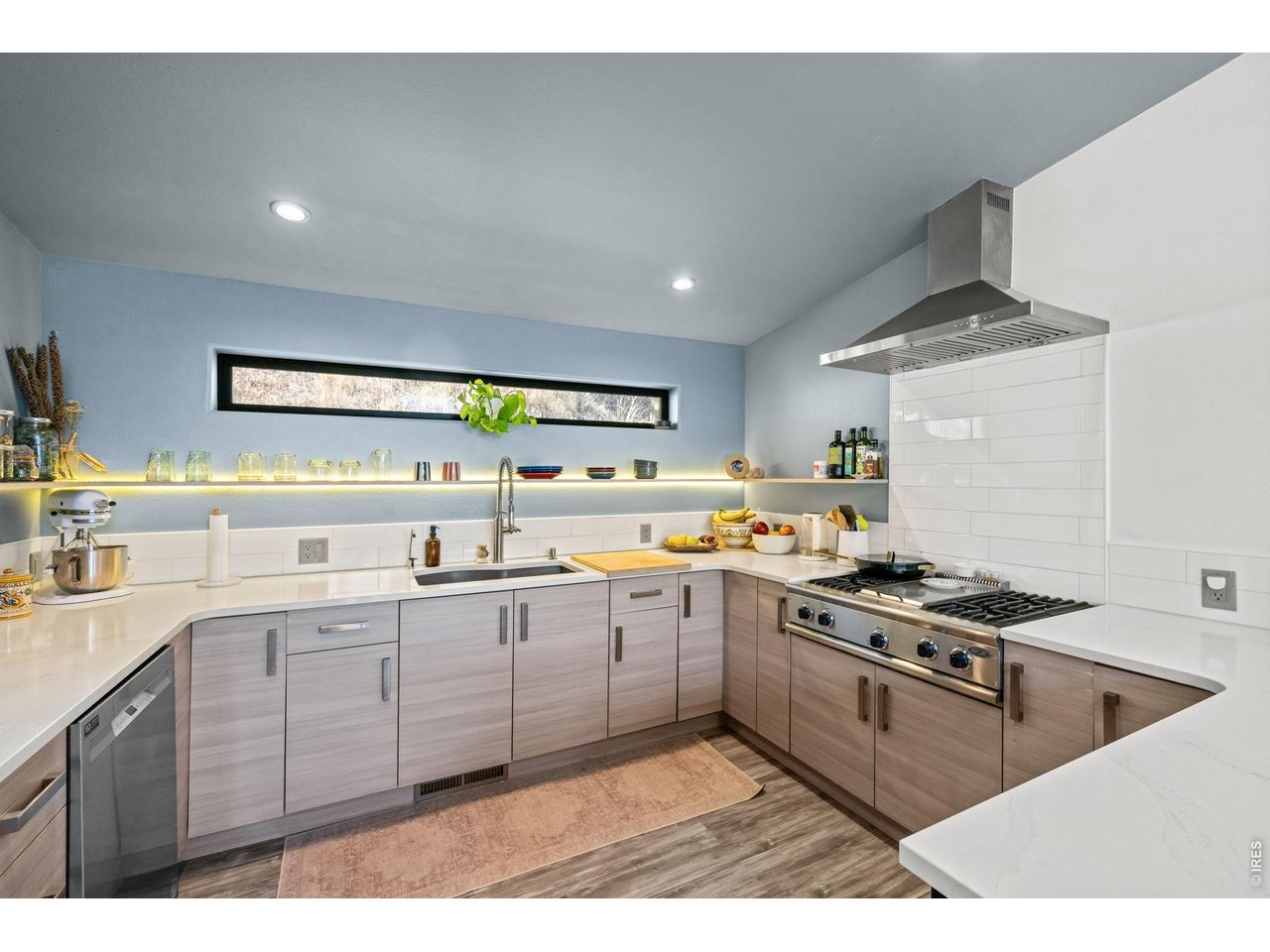 865 North Cedar Brook Road Boulder, CO 80304 - Photo 14 of 49 a kitchen with stainless steel appliances granite countertop a stove a sink dishwasher and white cabinets with wooden floor