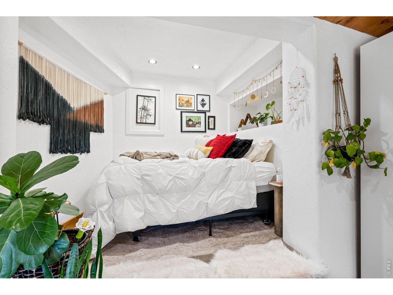 865 North Cedar Brook Road Boulder, CO 80304 - Photo 37 of 49 a bed room with a bed mirror and a potted plant