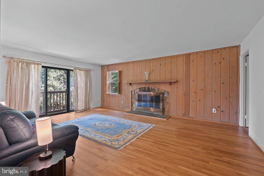 9704 Hall Road Potomac, MD 20854 - Photo 19 of 41 a living room with furniture and a fireplace