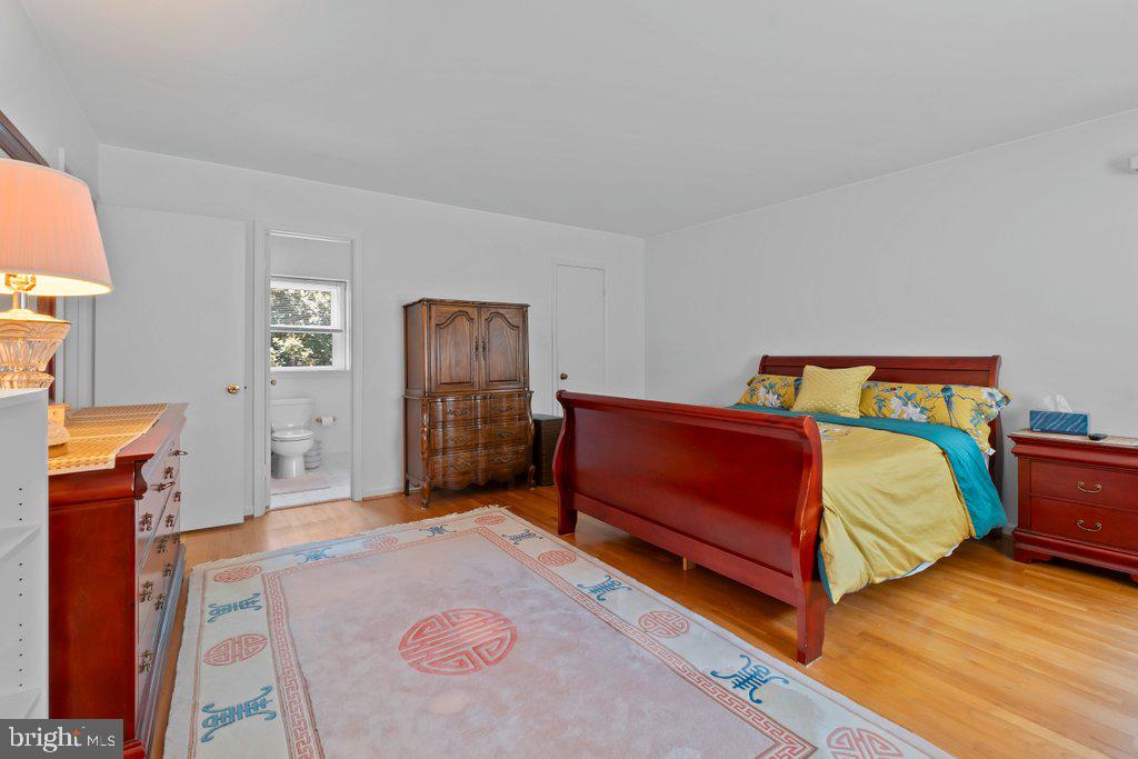 9704 Hall Road Potomac, MD 20854 - Photo 24 of 41 a bedroom with a bed and a dresser