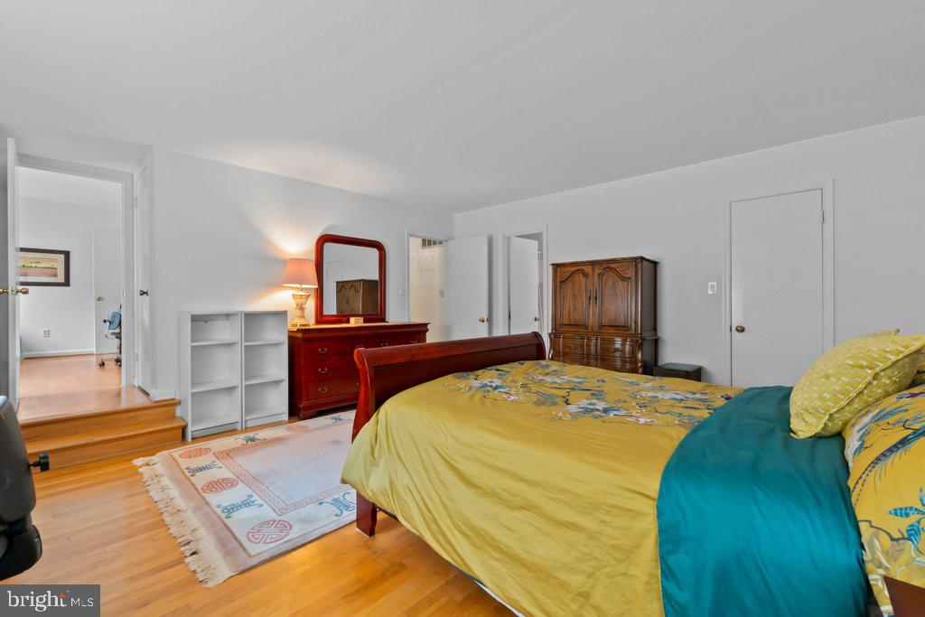 9704 Hall Road Potomac, MD 20854 - Photo 25 of 41 a bedroom with a bed and a view of kitchen