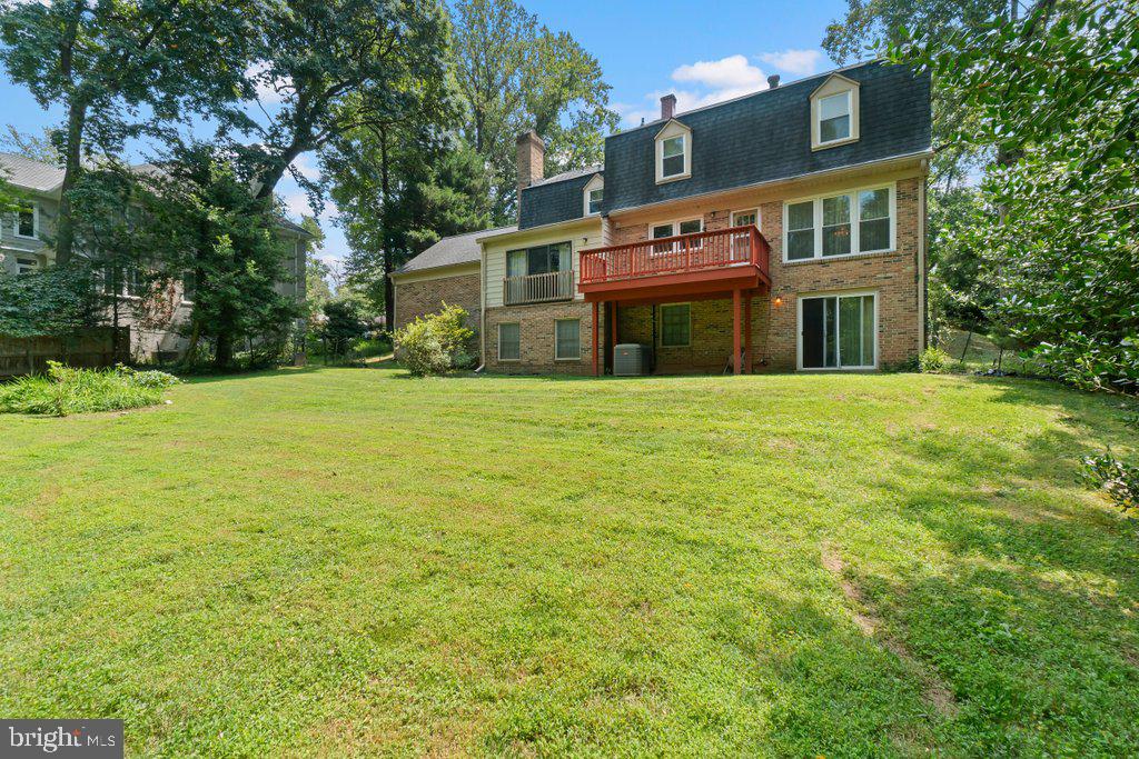 9704 Hall Road Potomac, MD 20854 - Photo 40 of 41 a view of an house with floor to ceiling window and tree