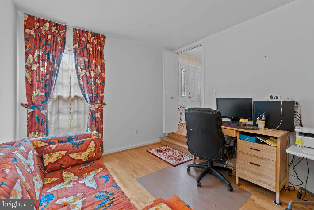 9704 Hall Road Potomac, MD 20854 - Photo 5 of 41 a bedroom with a workspace