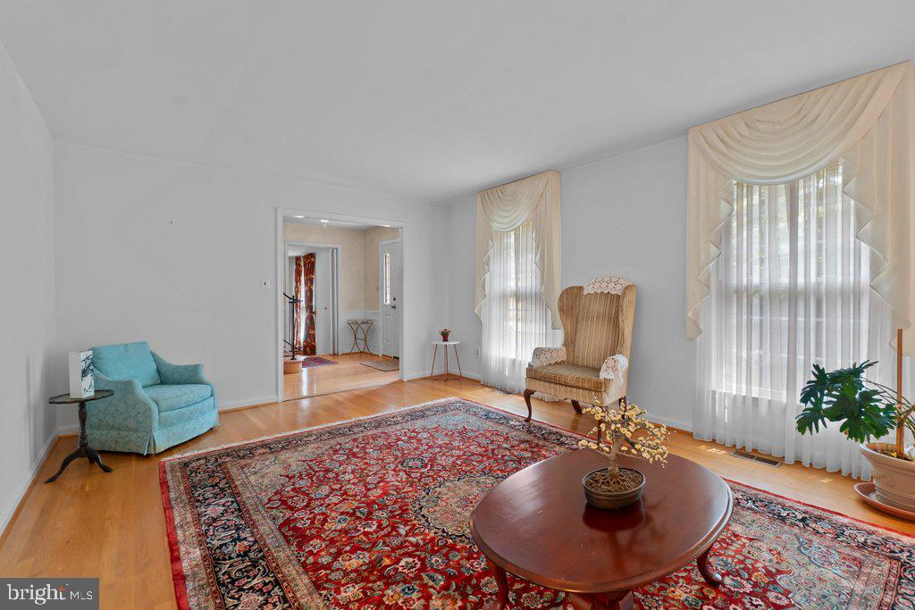 9704 Hall Road Potomac, MD 20854 - Photo 9 of 41 a living room with furniture and a potted plant