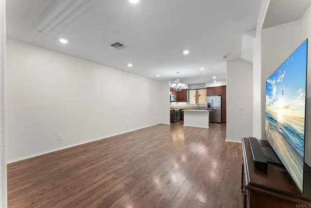 a view of kitchen with furniture and wooden floor