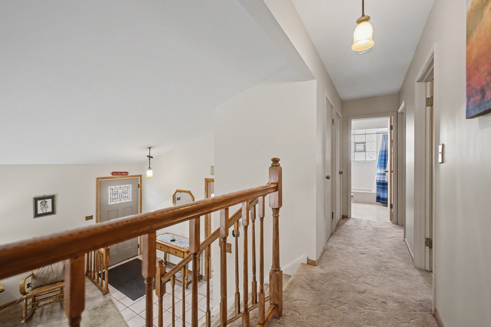 118 Evergreen Street Addison, IL 60101 - Photo 15 of 38 a view of a hallway with wooden floor and stairs