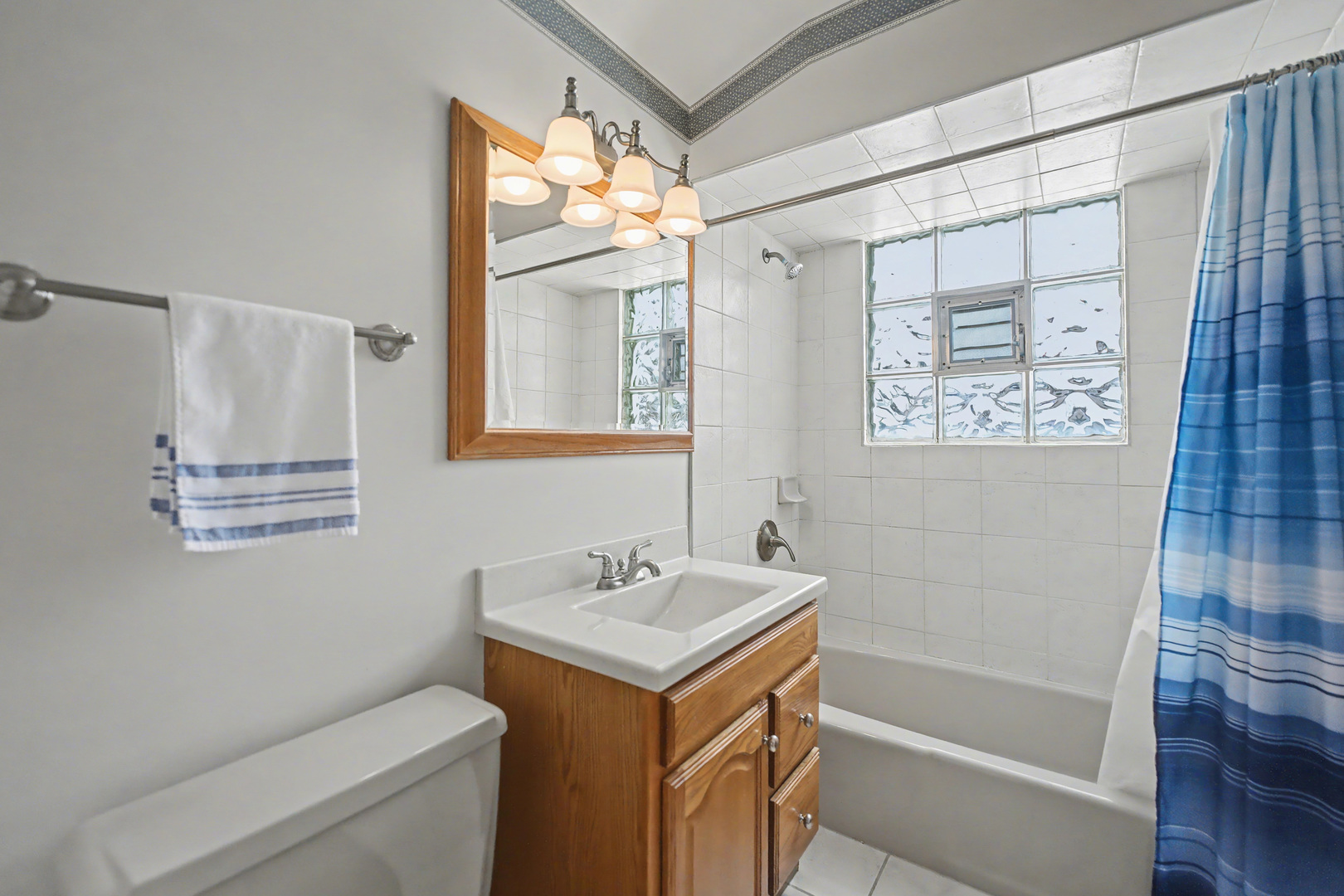 118 Evergreen Street Addison, IL 60101 - Photo 21 of 38 a bathroom with a shower sink and mirror