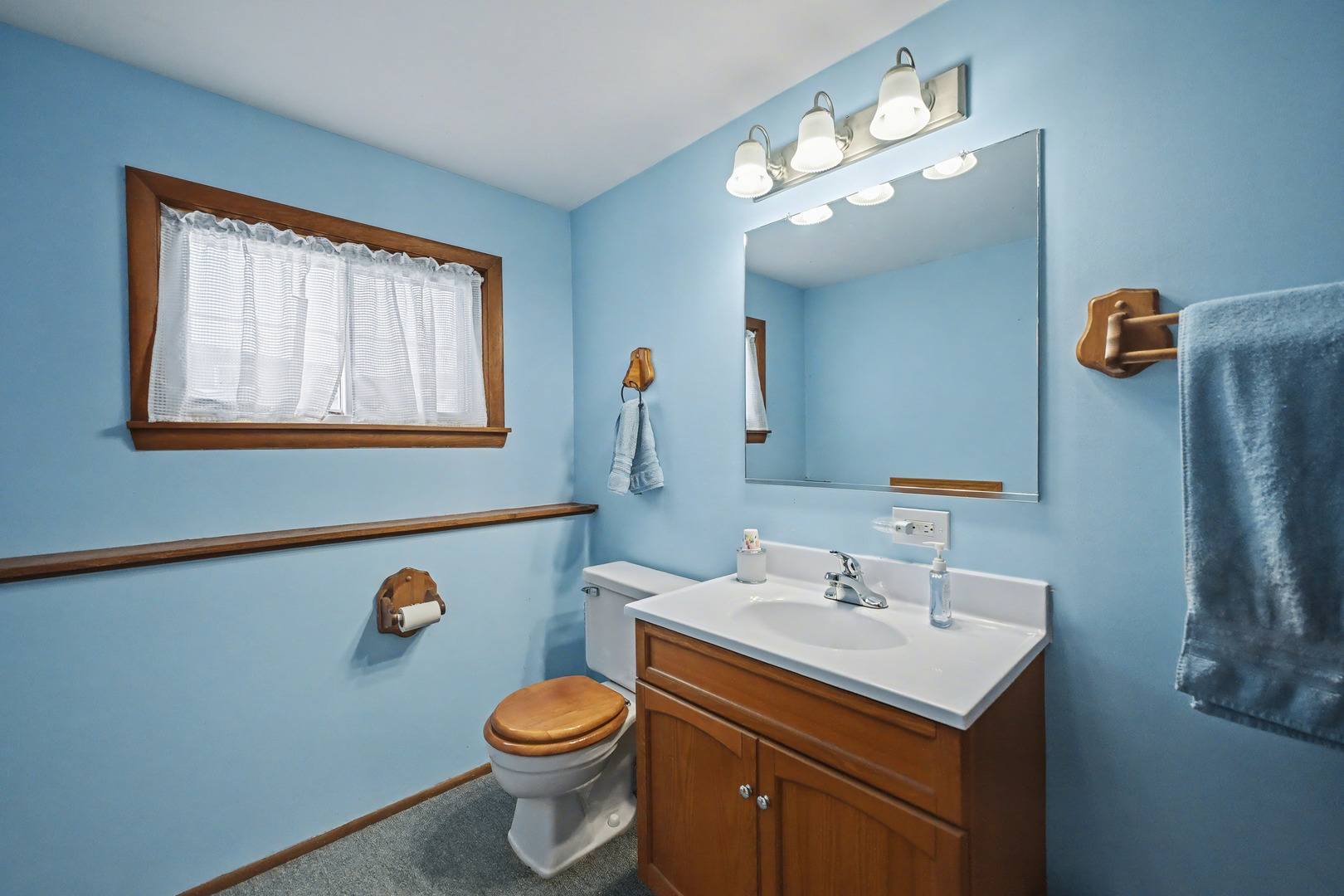118 Evergreen Street Addison, IL 60101 - Photo 24 of 38 a bathroom with a sink mirror vanity and toilet